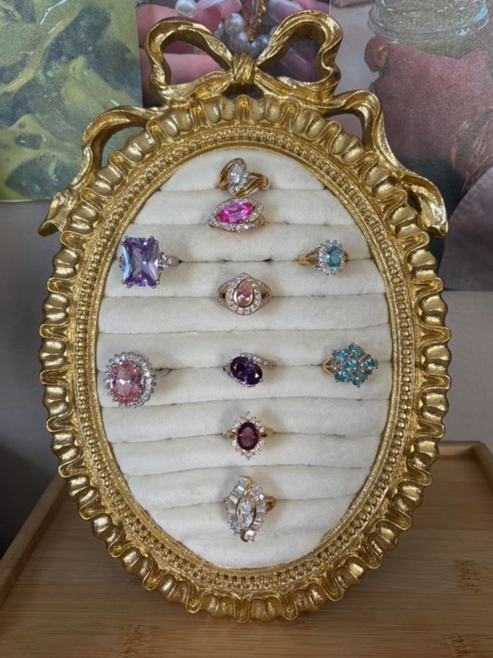 Gold Frame Display of Multi-Gem Women’s Rings - Pink, Purple, Blue, Clear